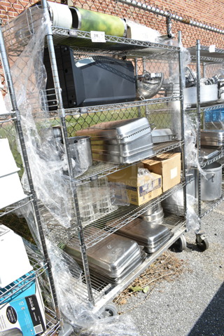 Chrome Finish 4 Tier Shelving Unit on Commercial Casters w/ Contents Including Stainless Steel Drop In Bins, Iced Tea Holder Dispenser. BUYER MUST DISMANTLE. PCI CANNOT DISMANTLE FOR SHIPPING. PLEASE CONSIDER FREIGHT CHARGES. 