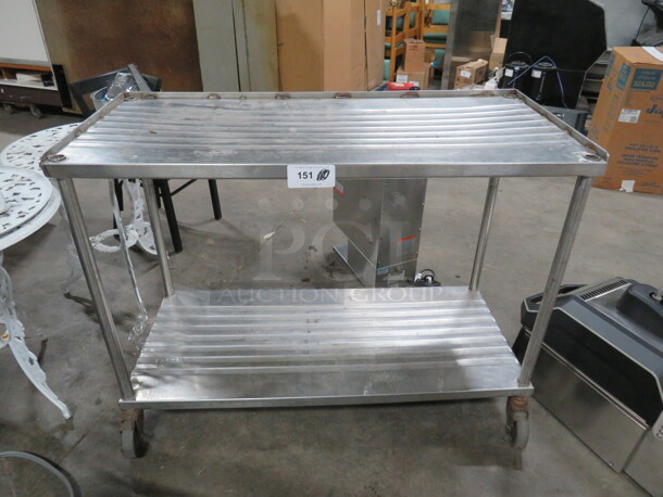 One Metal Table With Under Shelf On Casters. 48X21X36