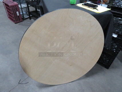 One 36 Inch Round Wooden Table Top.