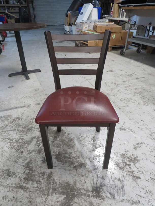 Brown Metal Chair With A Red Cushioned Seat. 3XBID - Image 1 of 2