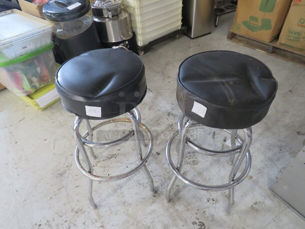 Double Chrome Ring Bar Stool With A Black Cushioned Swivel Seat. Need To Be Recovered. 2XBID - Image 1 of 1