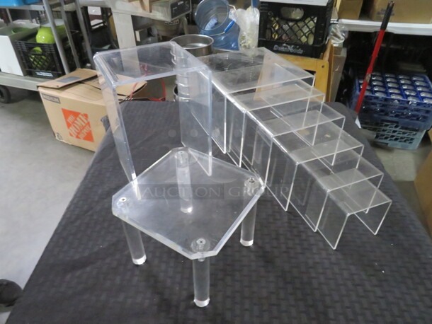 One Lot Of Assorted Size Clear Poly Stands. - Image 1 of 3