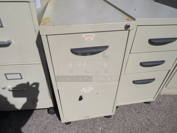 One 2 Drawer Metal File Cabinet On Casters. Missing 1 Handle. 15X23X27.5