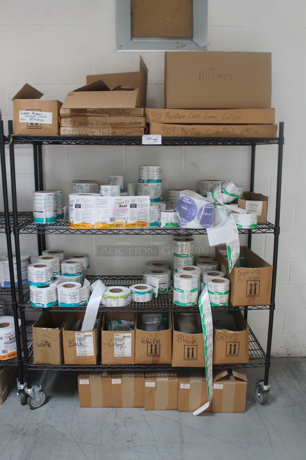 Black 4 Tier Wire Shelving Unit w/ Contents Including Labels on Commercial Casters. BUYER MUST REMOVE. - Image 1 of 8