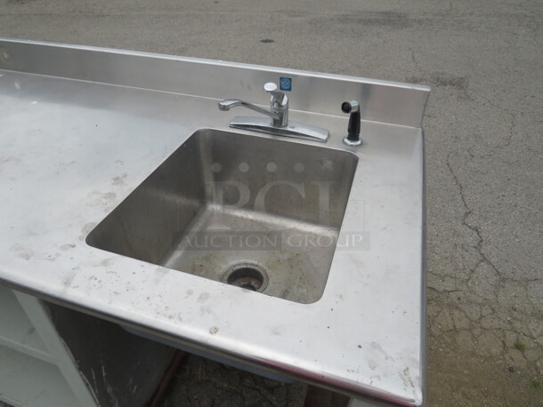 One Stainless Steel Drink Table With Drain And Sink, Faucet, 2 SS Under Shelves, And A Backsplash. Missing Legs. 96X30X40. - Image 2 of 2