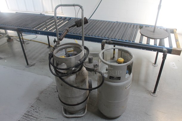 ALL ONE MONEY! Lot of 2 Metal Propane Gas Tanks and 1 Tank Dolly - Image 1 of 5