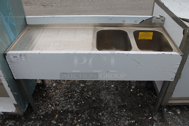 BRAND NEW SCRATCH AND DENT! Krowne 18-42R Stainless Steel 2 Bay Back Bar Sink w/ Left Side Drain Board and Back Splash. Bays 10x14x9.5. Drain Board 24.5x16 - Image 1 of 5