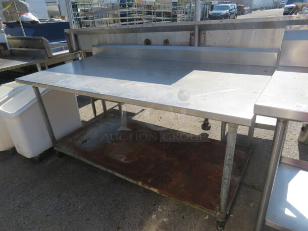 One Stainless Steel Table With Under Shelf On Casters. 72X37X40