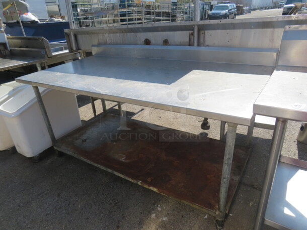 One Stainless Steel Table With Under Shelf On Casters. 72X37X40 - Image 1 of 1