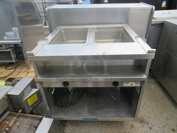 One SS Randell 2 Well Steam Table With Stainless Under Shelf On Casters. Model# 3612-240. 208/240 Volt. 1 Phase. 33X33X35