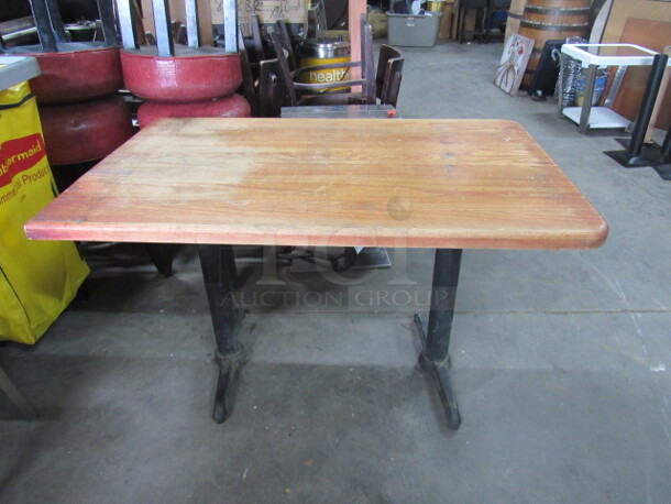 One Wooden Wall Sided Table With Dual Pedestal Bases. 48X30X30