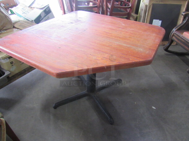 One Wooden Table On A Pedestal Base. 42X42X30