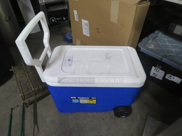 One 38 Quart Igloo Cooler With Wheels.