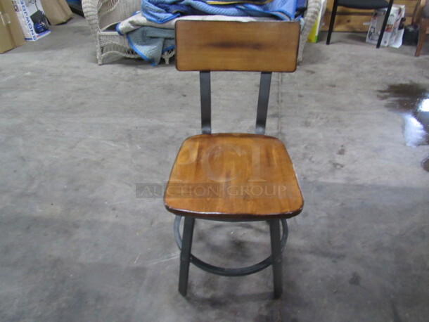 One Industrial Look Metal Framed Chair With Wooden Seat And Back With Metal Footrest. 
