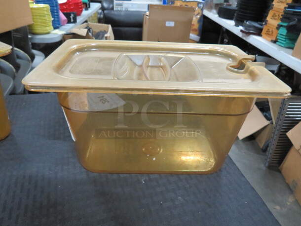 One 1/4 Size 6 Inch Deep Amber Food Storage Container With Lid.
