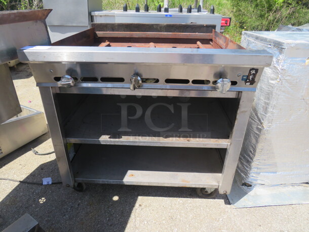 One Natural Gas Charbroiler With 2 Under Shelves On Casters. Missing Grates. 36X37X36 - Image 1 of 2
