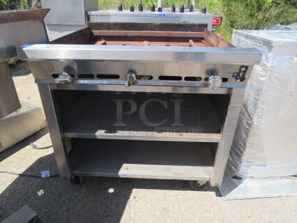 One Natural Gas Charbroiler With 2 Under Shelves On Casters. Missing Grates. 36X37X36
