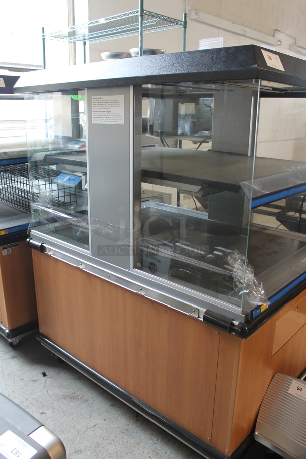 Metal Commercial Floor Style Electric Powered Heated 2 Tier Merchandiser on Commercial Casters. - Image 1 of 7