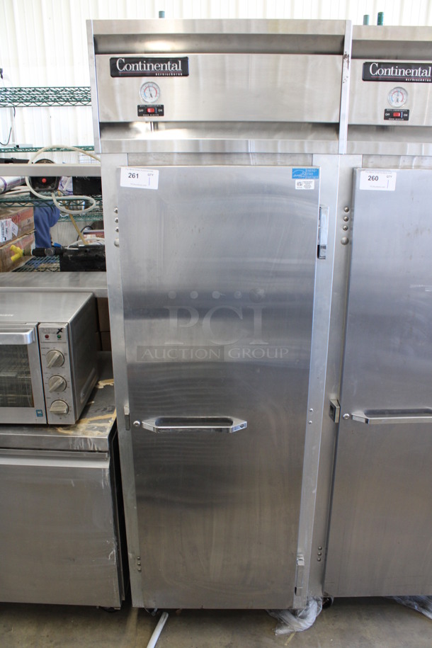 Continental Model 1R Stainless Steel Commercial Single Door Reach In Cooler w/ Poly Coated Racks on Commercial Casters. 115 Volts, 1 Phase. 26.5x35x82. Tested and Working!