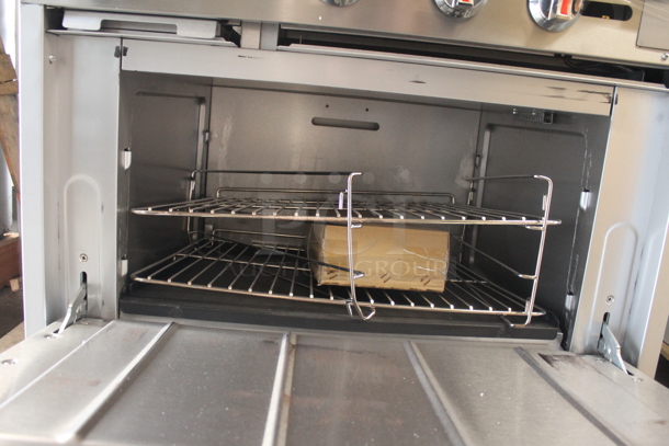 BRAND NEW SCRATCH AND DENT! Cooking Performance Group 351S36G24L Stainless Steel Commercial Propane Gas Powered 2 Burner Range with 24" Griddle, Oven, Over Shelf and Back Splash. 130,000 BTU. - Image 7 of 11