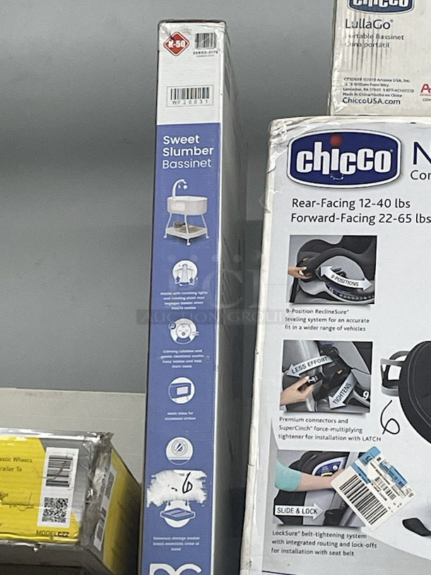 MASSIVE LOT! (3) Little Tikes 2-In-1 Snug & Secure Swings – 1 Blue, 2 Pink; (17) Nuby Water Resistant Baby Bibs (assorted colors); (1) Graco “Caden Fashion” Comfy Cruiser™ Travel System With Snugride® 30; (1) Allen YOOGO CZ2 Convertible Cargo Trailer → Handy Pull Cart,  (1) Delta Children Sweet Slumber Bassinet, (1) Chicco LullaGo Portable Bassinet, (1) Chicco NextFit Sport Convertible Car Seat, (2) Evenflo Omni Plus Modular Travel System – Includes LITEMAX Rear-Facing Infant Car Seat, (1) Baby Trend EZ Ride Girl 35 - Includes NEW 4-35 Ibs Infant Car Seat , (1) Evenflo Nurture Infant Car Seat Base. 11x Your Bid - Image 11 of 12