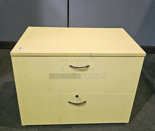 Oak locking lateral file with two drawers and drawer pulls. In like-new condition! 30"H x 36"W x 20"D. BIDX2.  - Image 1 of 3