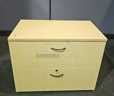 Oak locking lateral file with two drawers and drawer pulls. In like-new condition! 30"H x 36"W x 20"D. BIDX2. 