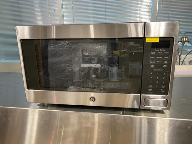 GE Brand New Scratch & Dent22 Inch 1.6 cu. ft. Capacity Countertop Microwave with 1150 Cooking Watts, Sensor Cook, UL Listed, Sensor Cooking, Weight and Time Defrost, Add 30 Seconds, Timer, UL Certification, Control Lock, Touch Controls in Stainless Steel - Image 1 of 5