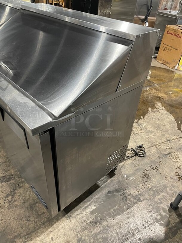 True Mega Top Sandwich/Salad Prep Table! All Stainless Steel! With 3 Door Refrigerated Storage Underneath! With poly Coated Racks! 115V 1 Phase! On Casters! Model: TSSU-72-18 SN: 1-4477571!  - Image 2 of 11