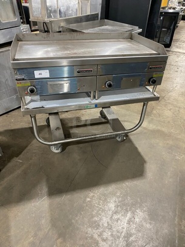 WOW! NEW! NEVER USED! Garland Commercial Countertop Electric Powered Flat Top Griddle! With Back And Side Splashes! On Legs! On Equipment Stand! All Stainless Steel! On Casters! Model: E2448G SN: 0404ME0033 208V 60HZ 3 Phase - Image 1 of 10
