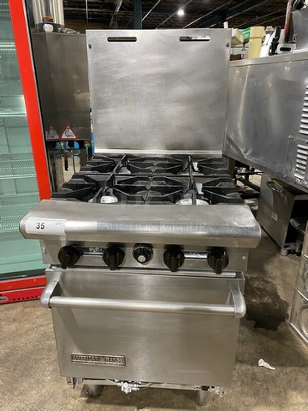 American Range Commercial Natural Gas Powered 4 Burner Stove! With Raised Back Splash! With Oven Underneath! All Stainless Steel! On Legs!