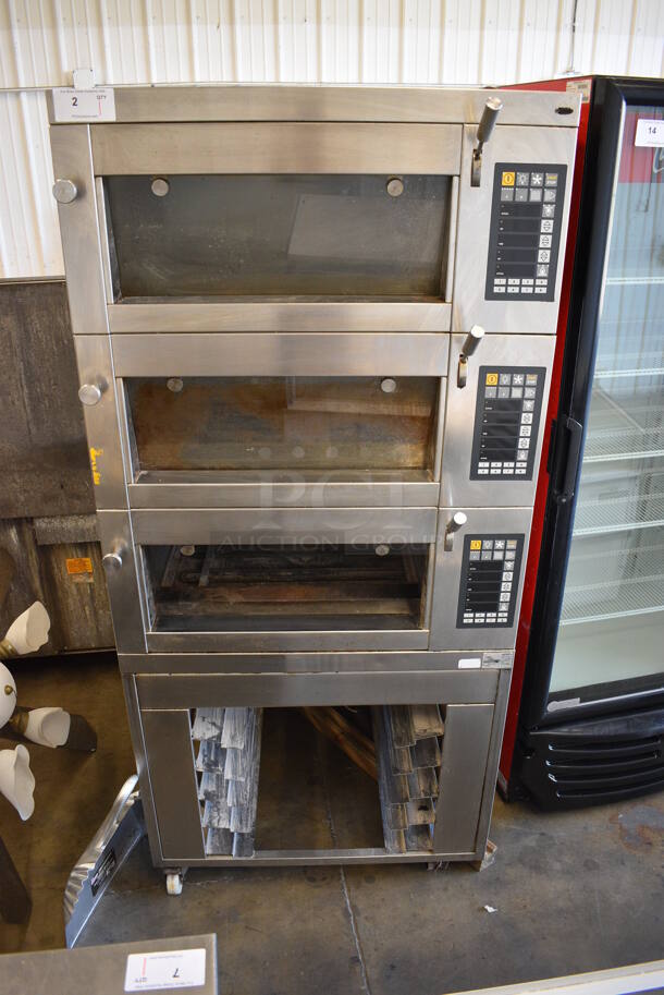 Miwe Model CO 2.060 Stainless Steel Commercial Triple Deck Bakery Oven on Commercial Casters. Missing Pane of Glass and Caster. 208 Volts, 3 Phase. 35.5x32x77.5