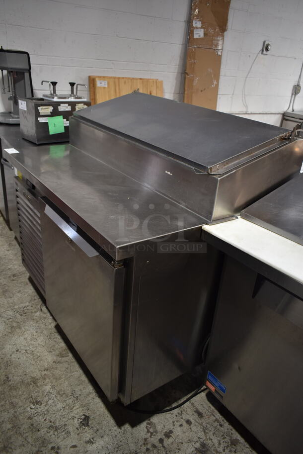 2016 Traulsen T5048HT Stainless Steel Commercial Pizza Prep Table on Commercial Casters. 115 Volts, 1 Phase. Tested and Powers On But Does Not Get Cold
