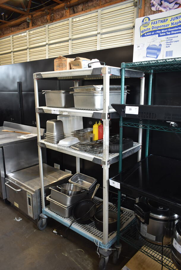 ALL ONE MONEY! Metro Lot of Various Items Including Stainless Steel Drop In Bins and Poly Condiment Bottles. Does Not Include Shelving Unit. - Image 1 of 5