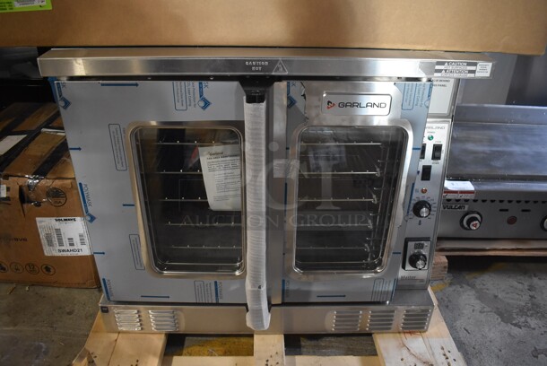 BRAND NEW IN BOX! 2022 Garland MCO-GS-10S Stainless Steel Commercial Natural Gas Single Deck Standard Depth Full Size Convection Oven w/ View Through Doors, Metal Oven Racks and Thermostatic Controls. 60,000 BTU. 38x38x32. Tested and Working!