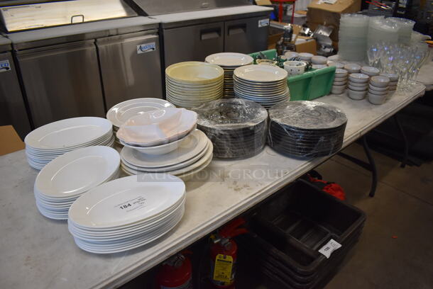ALL ONE MONEY! Lot of Items on Tabletop Including Ceramic Plates, Ceramic Bowls, Silverware and Glasses