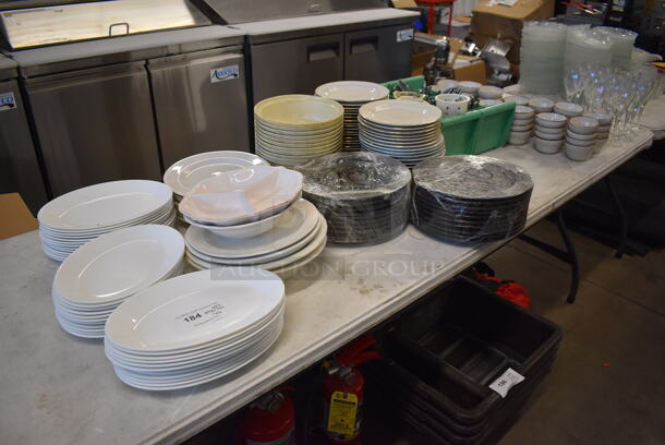 ALL ONE MONEY! Lot of Items on Tabletop Including Ceramic Plates, Ceramic Bowls, Silverware and Glasses - Image 1 of 7