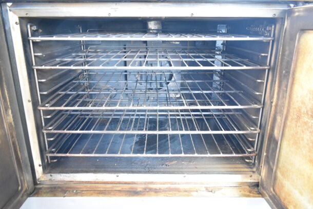 Vulcan VC4GD-64 Stainless Steel Commercial Full Size Convection Oven w/ View Through Doors, Metal Oven Racks, Thermostatic Controls and Metal Legs on Commercial Casters.  - Image 3 of 4