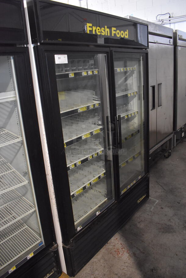 True GDM-49 Two Section Reach-In Floor Standing Glass Door Merchandiser Cooler In Black With Plastic Dividers. 115V, 1 Phase. Tested And Working - Image 2 of 6
