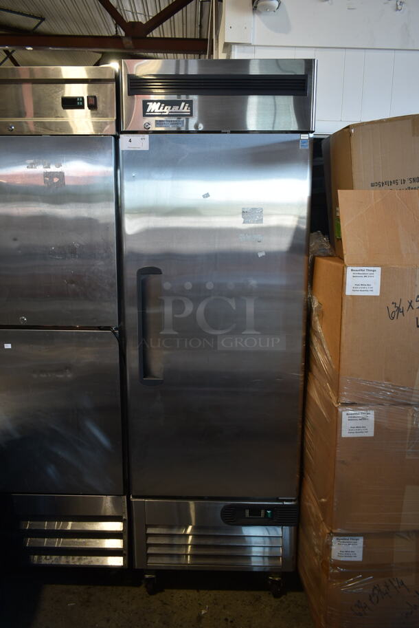 BRAND NEW SCRATCH AND DENT! 2020 Migali C-1RB-HC Stainless Steel Commercial Single Door Reach In Freezer w/ Poly Coated Racks on Commercial Casters. 115 Volts, 1 Phase. Tested and Powers On But Does Not Get Cold - Image 1 of 10