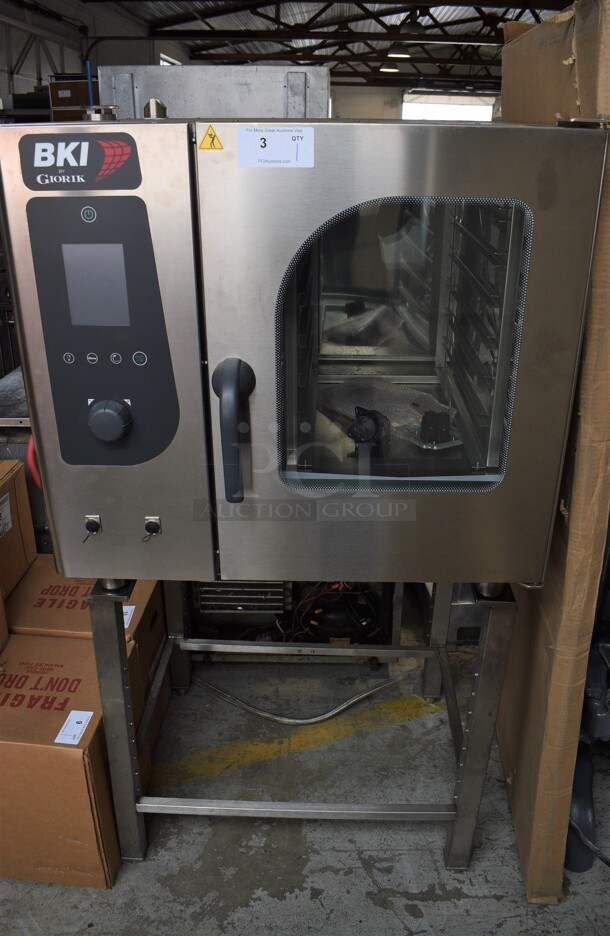 BRAND NEW! BKI Model ABTE061 Stainless Steel Commercial Electric Powered Convection Oven on Stand. 208 Volts, 3 Phase. 34x31x67