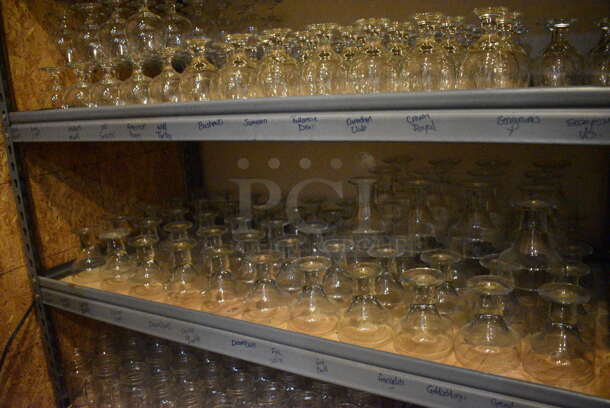 Gray Metal 5 Tier Shelving Unit w/ Contents Including Tall Glass Mugs and Wine Glasses. 48x24x72. BUYER MUST REMOVE; BUYER MUST DISMANTLE. PCI CANNOT DISMANTLE FOR SHIPPING. PLEASE CONSIDER FREIGHT CHARGES. (glass room - off of bar area) - Image 3 of 6