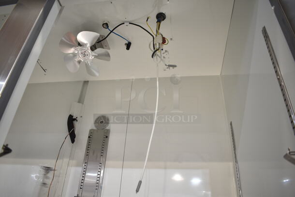 BRAND NEW SCRATCH AND DENT! 2023 Avantco 178A49FHC Stainless Steel Commercial 2 Door Reach In Freezer w/ Poly Coated Racks on Commercial Casters. 115 Volts, 1 Phase. Tested and Does Not Power On - Image 8 of 10