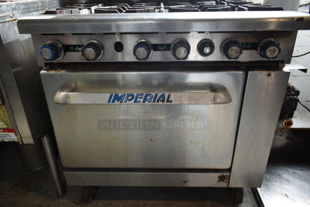 Imperial IR-6 Stainless Steel Commercial Natural Gas Powered 6 Burner Range w/ Oven and Back Splash on Commercial Casters.  - Image 3 of 7