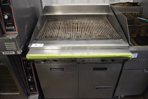 Garland M34B Stainless Steel Commercial Natural Gas Powered Charbroiler Grill w/ 2 Doors on Commercial Casters. 34x35x44