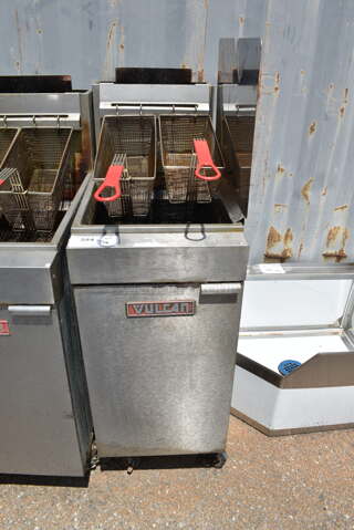 Vulcan LG300-1 Stainless Steel Commercial Floor Style Natural Gas Powered Deep Fat Fryer w/ Side Splash Guard and 2 Metal Fry Baskets on Commercial Casters. 90,000 BTU.
