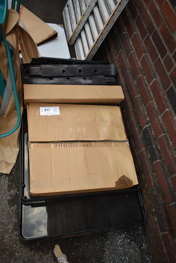 BRAND NEW SCRATCH AND DENT! Rubbermaid FG452010BLA Black Medium Lipped Heavy Duty Two Shelf Utility Cart with Ergonomic Handle and 8" Pneumatic Casters - Image 2 of 6