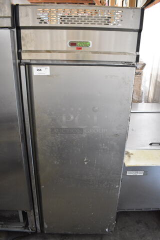 Stainless Steel Commercial Single Door Reach In Chiller on Commercial Casters. 220 Volts, 1 Phase. Tested and Powers On But Does Not Get Cold