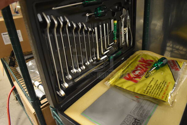 ALL ONE MONEY! Tier Lot of Various Items Including Steel Floor Jack with Case, Tool Kit, Light Bulbs, and Gloves - Image 5 of 7