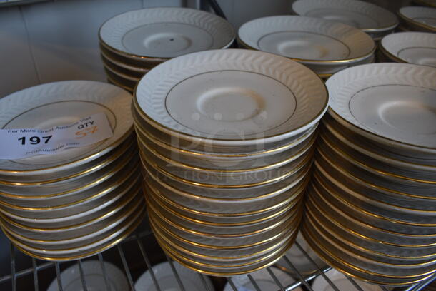 57 White Ceramic Saucers w/ Gold Line on Rim. 5.75x5.75x1. 57 Times Your Bid!